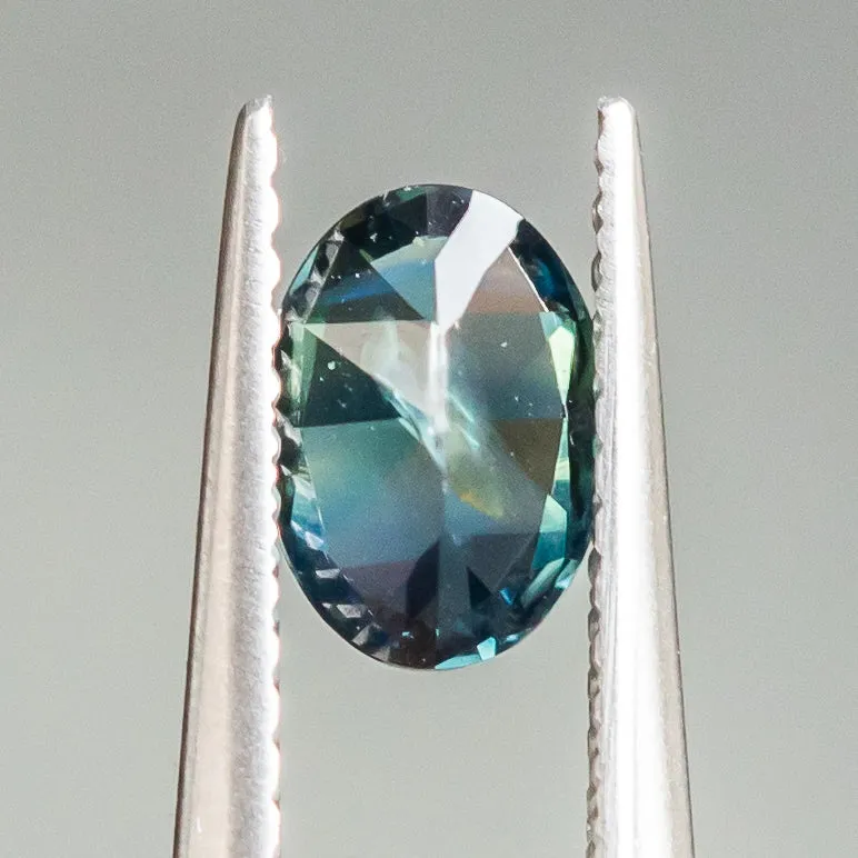 0.92CT OVAL NIGERIAN SAPPHIRE, TEAL PARTI GREEN, 7.01X5.01X3.27MM, UNTREATED