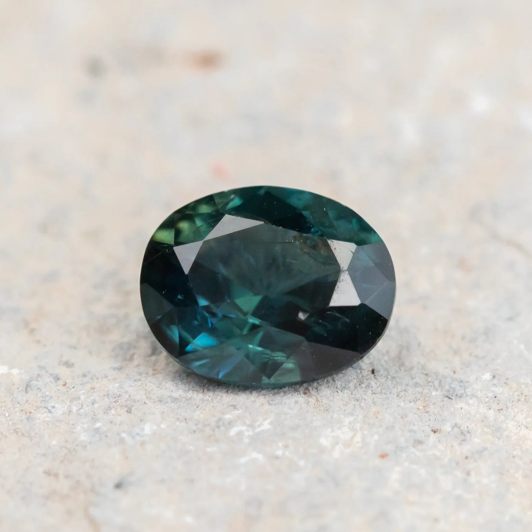 1.61CT NIGERIAN OVAL SAPPHIRE, DEEP TEAL PARTI GREEN, 7.88X6.4X4.05MM, UNTREATED