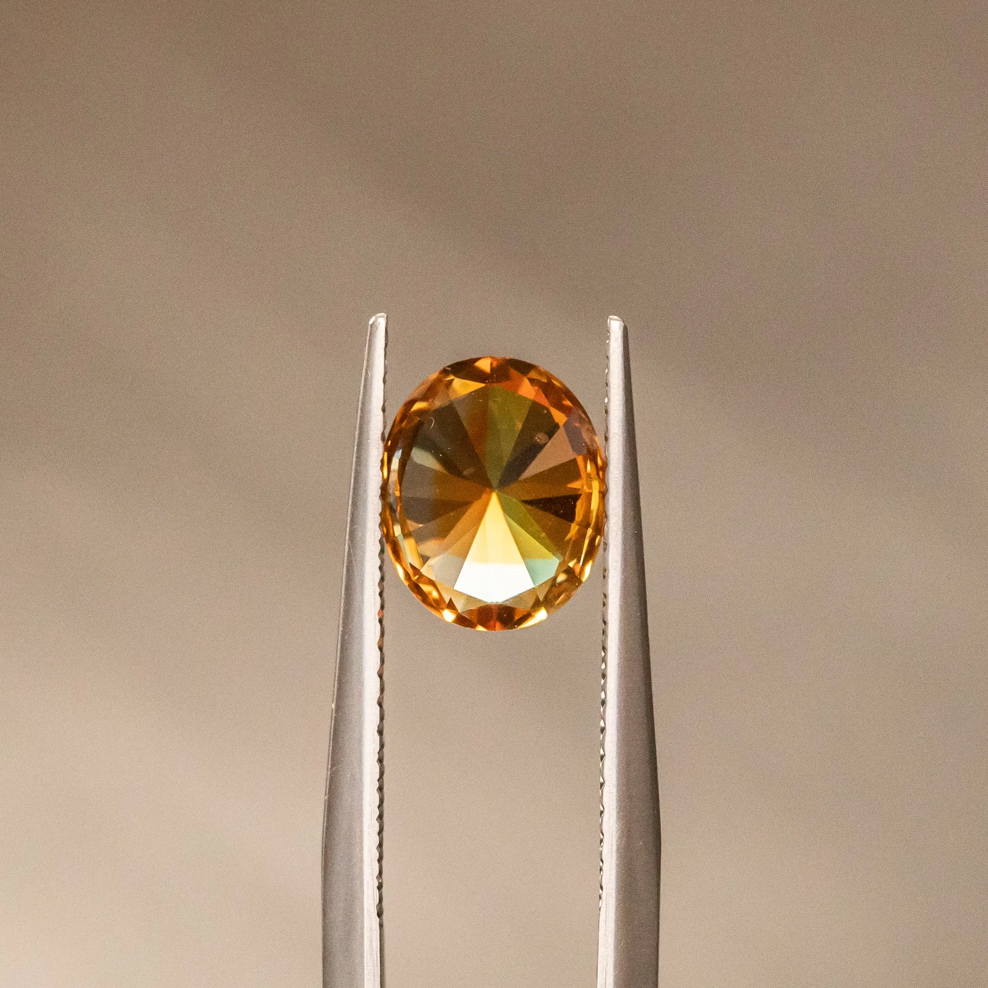 2.35CT OVAL PRECISION CUT MONTANA SAPPHIRE, BICOLOR PARTI ORANGE YELLOW CHAMPAGNE, 8.37X6.98MM