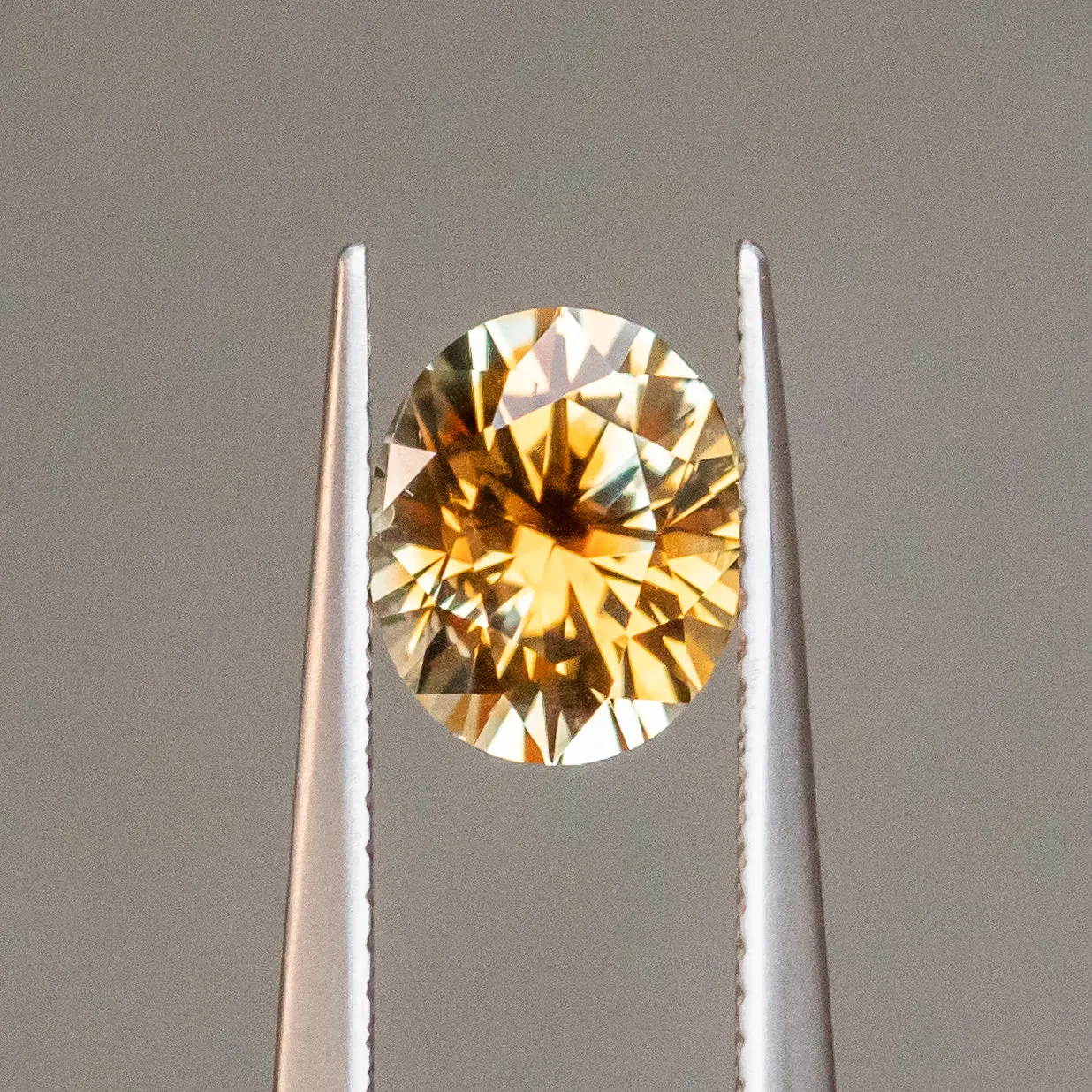 2.35CT OVAL PRECISION CUT MONTANA SAPPHIRE, BICOLOR PARTI ORANGE YELLOW CHAMPAGNE, 8.37X6.98MM